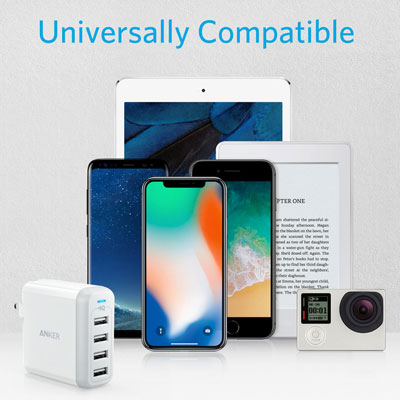 An Anker PowerPort 4 charger in front three phones, a Kindle reader, an action camera, and a tablet. Above them are texts reading as “Universally Compatible”